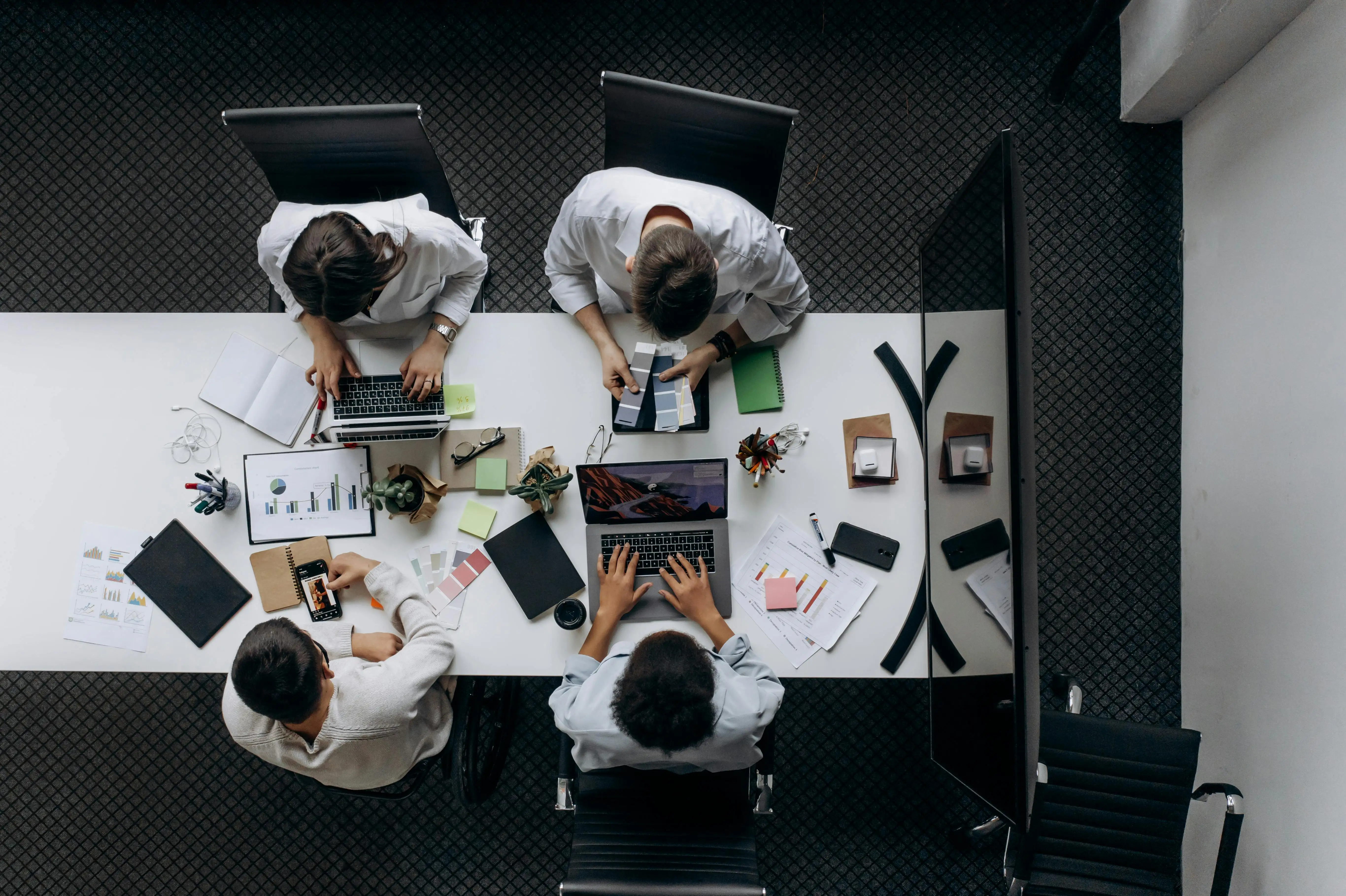 Team collaborating around a desk